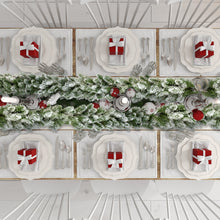 Load image into Gallery viewer, Christmas-themed table setting with Christmas greenery, red ornaments, and white plates.