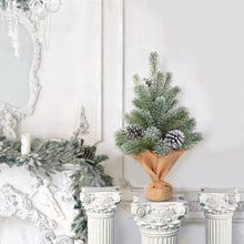 Load image into Gallery viewer, Decorative Christmas tree with pinecones on a white mantel with decorative columns.