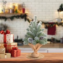 Load image into Gallery viewer, Decorative Christmas tree with pinecones and presents on a wooden table.