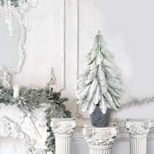 Load image into Gallery viewer, Decorative Christmas scene with a small tree and garland on a mantelpiece.
