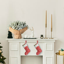 Load image into Gallery viewer, Decorative mantel with Christmas tree branches, stockings, and candles
