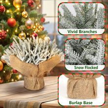Load image into Gallery viewer, Decorative faux Christmas tree with snow-flocked branches and burlap base
