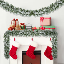 Load image into Gallery viewer, Decorative Christmas mantel decorated with long frosted garland with presents and stockings 
