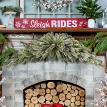 Load image into Gallery viewer, Decorated fireplace with Christmas flocked swag on mantel, including a sign that reads &#39;Sleigh Rides 25&#39;.
