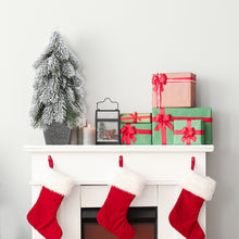 Load image into Gallery viewer, Christmas stockings hanging by a fireplace with presents and a small tree on the mantel.
